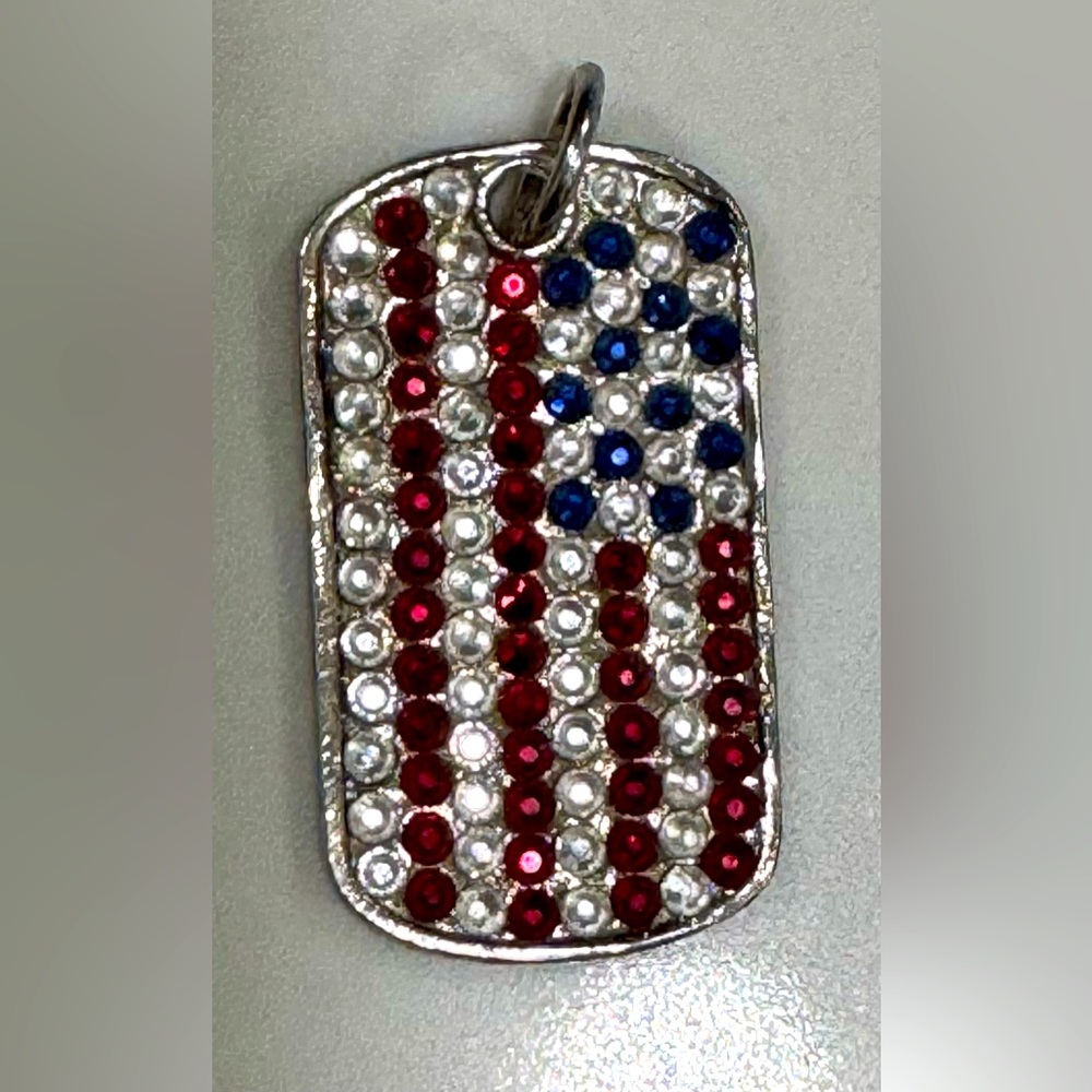 Sterling silver designer dog tag with flag pattern.